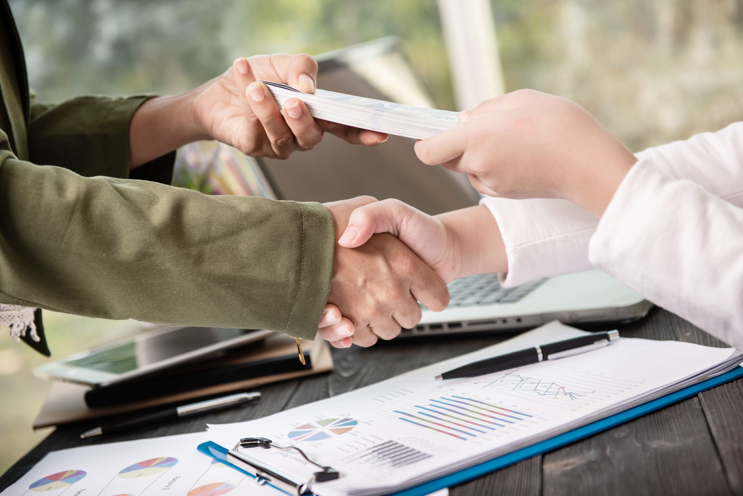 Business People Shaking Hands Finishing Up Meeting 1 Scaled