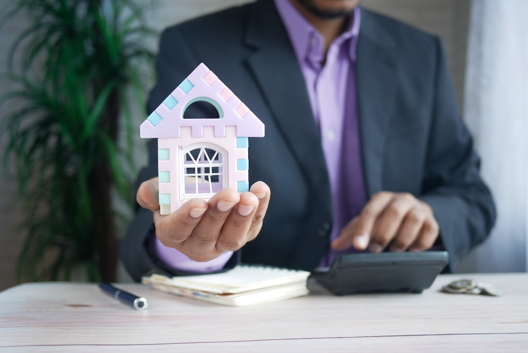 The Art of Drawing Readers In: Your attractive post title goes here the concept of finance concept , man holding house in hand .